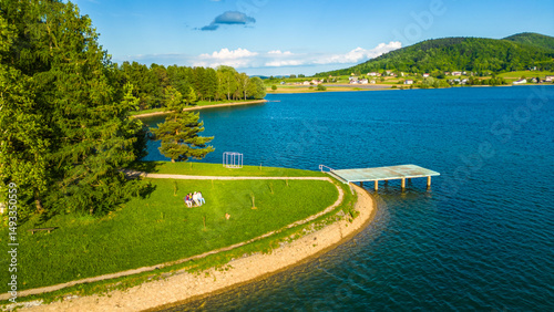 Scenic aerial view of lake (Jezero) Sabljaci near Ogulin, Croatia – a peaceful reservoir surrounded by forests and hills, perfect for outdoor activities and nature lovers photo