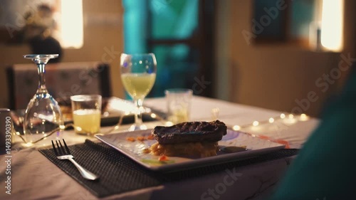 Fine Dining Service: Elegant Senegalese Waiter Serving Gourmet Steak Dish to Happy Customers, Beautifully Plated Dinner in Upscale Restaurant