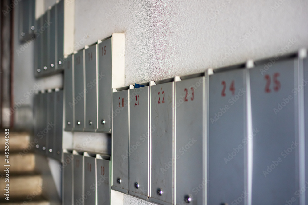 Fototapeta premium Mailboxes display numbers 23, 24, 25, and 26 clearly