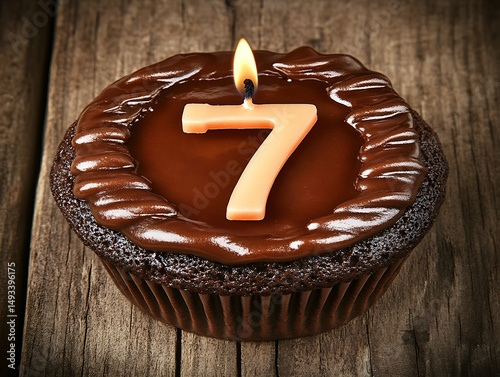 Chocolate cupcake with candle number seven