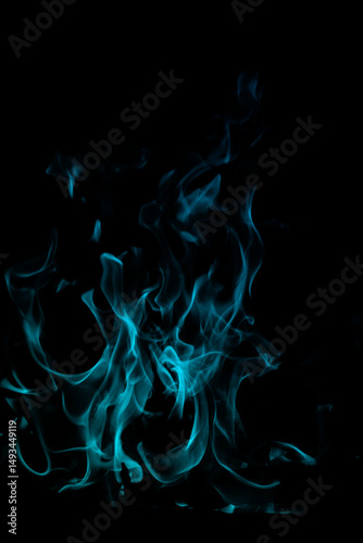 Blue Flame Dance on Black Background with Ethereal Light Glow