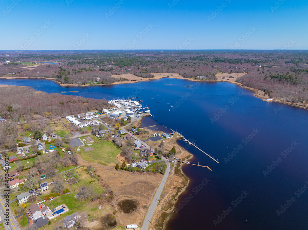 Fototapeta premium Taunton River aerial view in spring including Shaw's Boat Yard and Taunton Yacht Club in town of Dighton, Massachusetts MA, USA.