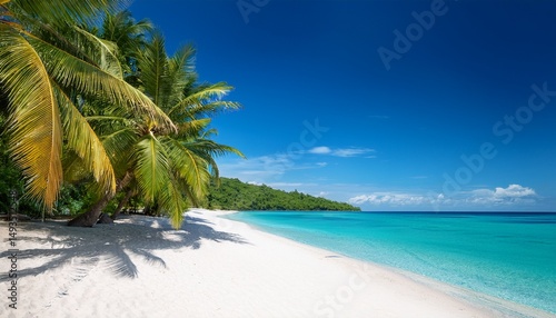 a white sandy beach with palm trees and blue sea