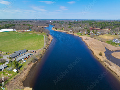 Taunton River aerial view in spring between historic town of Dighton and Berkley, Massachusetts MA, USA.  photo