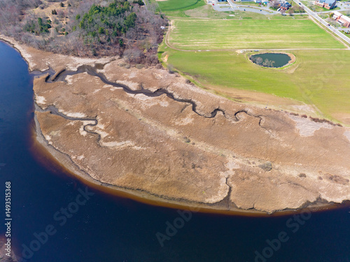 Wetland aerial view on Taunton River at Dighton town center in spring, Dighton, Massachusetts MA, USA.  photo
