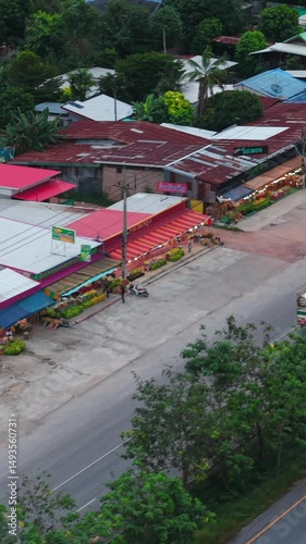 Shops in a market kluai khai next to a highway in rural Thailand photo