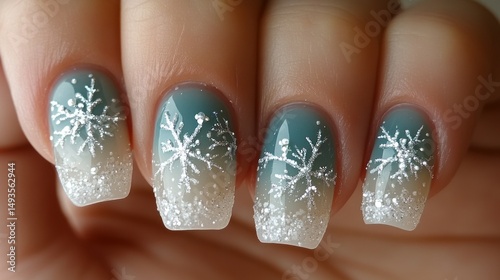 Winter-themed gradient nails with snowflakes