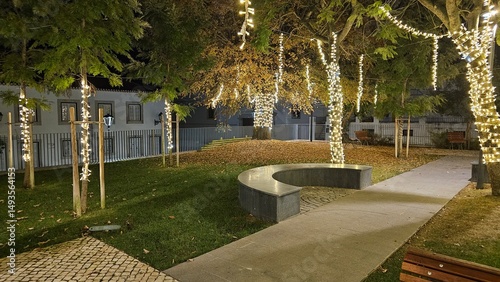 Walkway Through Park Decorated with Holiday Lights – Nighttime Urban Ambience in Portugal
