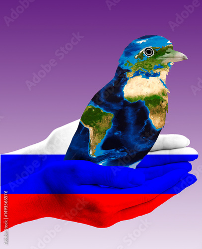 A bird with the texture of the globe. The hand of a man with the texture of the flag of Russia. The symbol of the power of the world