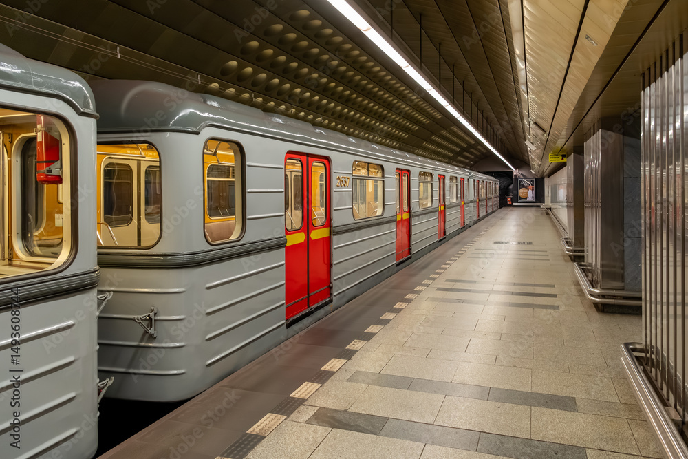 Obraz premium A five-car metro train operated by the Prague Public Transport Company in the metro network, which is the backbone of public urban transport in the capital of the Czech Republic.