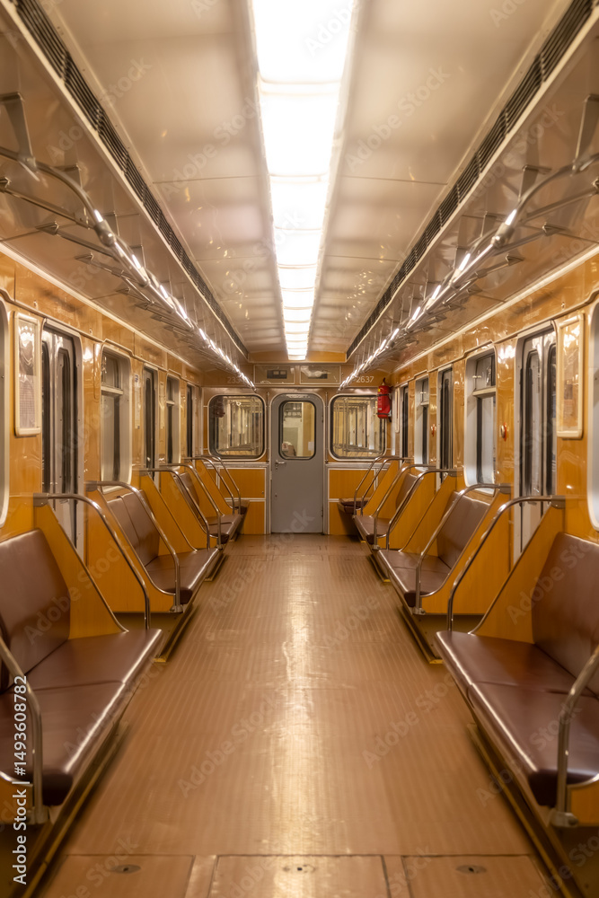 Fototapeta premium A five-car metro train operated by the Prague Public Transport Company in the metro network, which is the backbone of public urban transport in the capital of the Czech Republic.