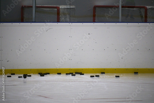 Photography Hockey pucks on ice for training