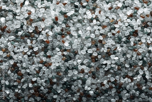 Close-up texture displaying small rocks in shades of clear white and dark gray