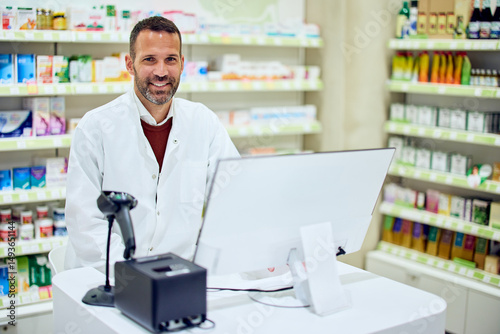 Wallpaper Mural Smiling Pharmacist Working Behind Counter in Modern Pharmacy Environment Torontodigital.ca