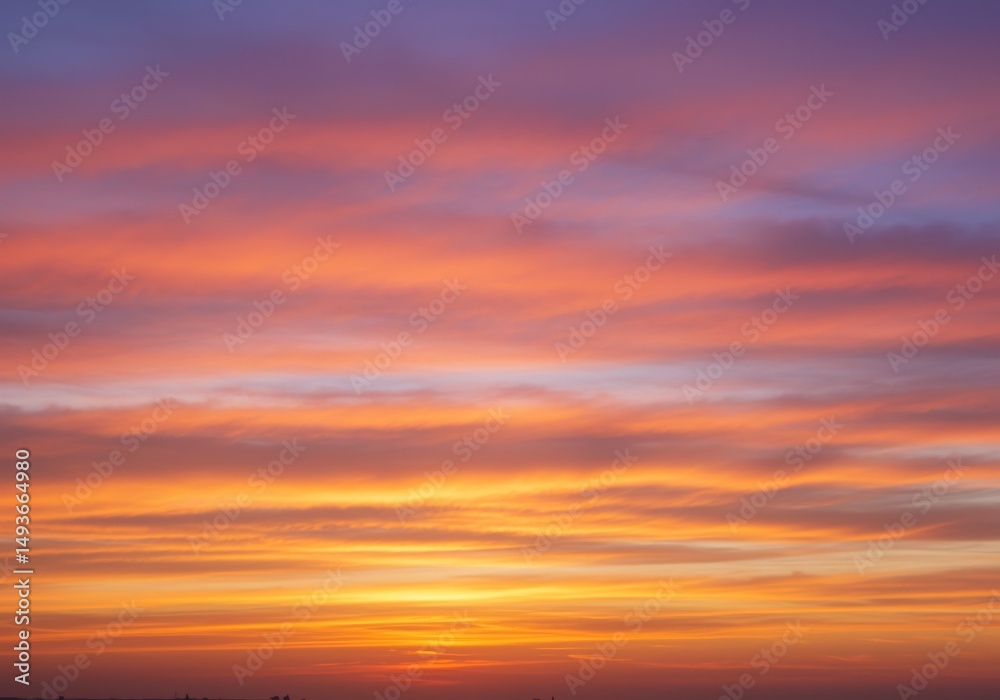 Obraz premium Serene Sunset Sky with Colorful Cloudscape - Peaceful sunset, vibrant colors, soft hues, tranquil atmosphere, hope and serenity. Captures the beauty of nature's artistry