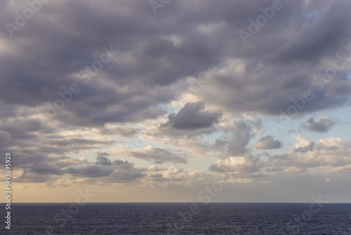 Dramatic Cloudscape Above the Expansive Pacific Ocean at Dusk