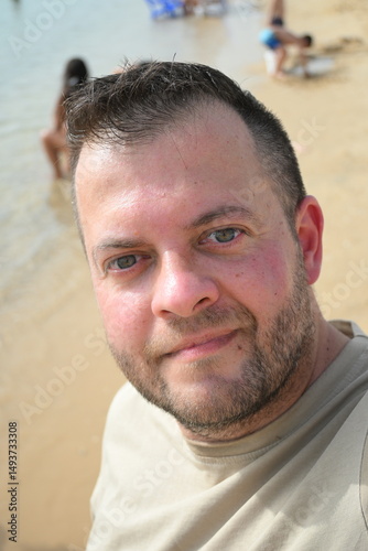 close up portrait of midage man on the beach