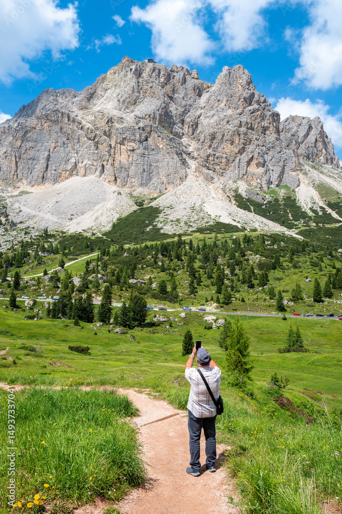 Fototapeta premium Capturing Nature: A smartphone Photographer in the Dolomite Mountains in Italy