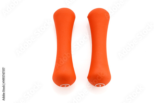 Two orange rubberized dumbbells isolated on white background. Sports equipment. Full depth of field.