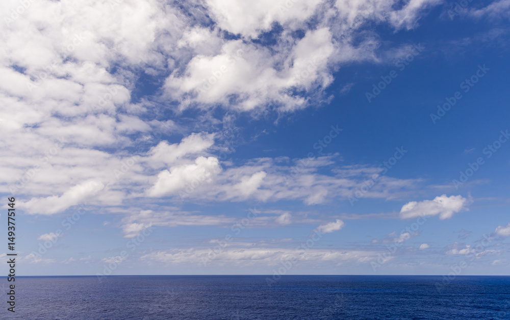 Fototapeta premium Scenic Seascape With Vibrant Blue Sky and Clouds over the Pacific Ocean