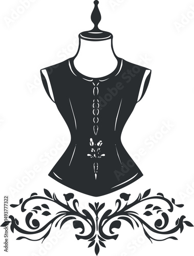 Black vintage corset on a mannequin with ornate floral decorative design below