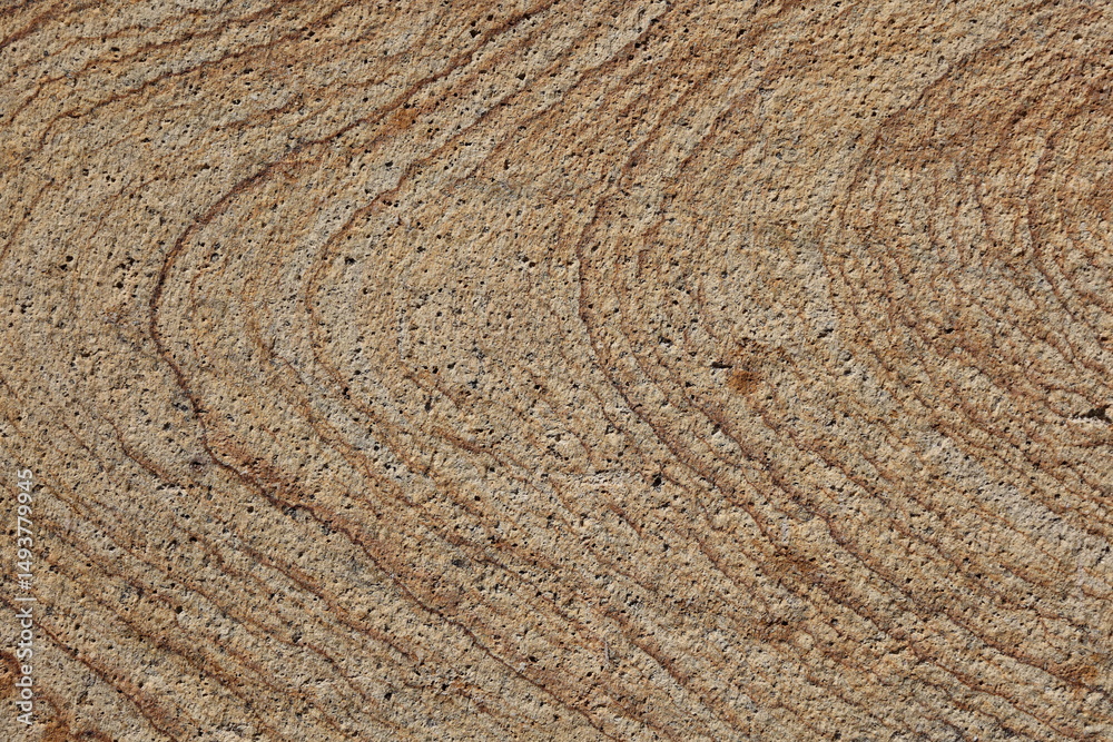 Naklejka premium Natural swirls, lines and textures of granite stone create a captivating brown backdrop
