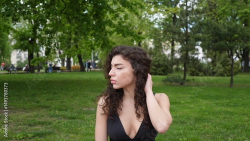 Joyful young girl portrait in a summer park
