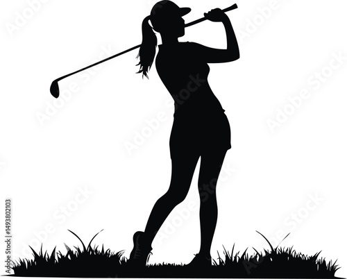 Silhouette of a Female Golfer Swinging a Golf Club on a Green Grassy Fairway