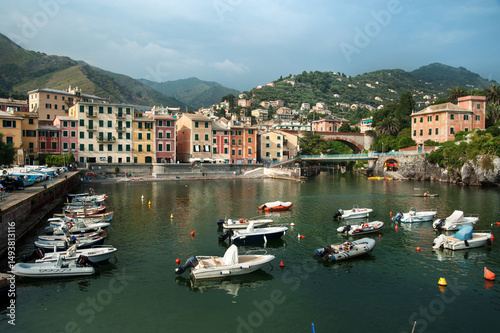 fishing boats and colorful houses of the coastal town of Nervi, Liguria, Geno...
