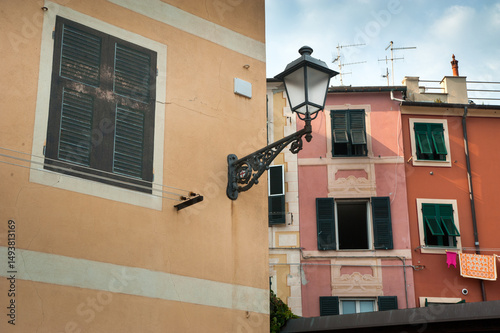 colorful houses with lanterns and shuttered windows on the streets of Nervi, ...