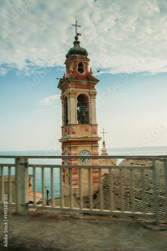 Beautiful church bell tower of Sant Ilario church in Nervi against a blue sky