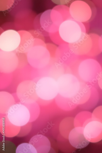 Abstract bokeh background, featuring vibrant pink circles and soft light effects