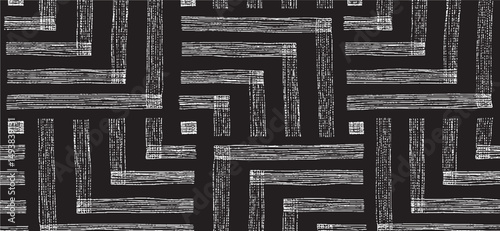 Black and white tileable pattern. Grunge worn damask pattern design. Distressed fabric texture. Overlay texture design. Vector illustration. 