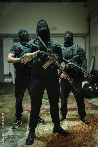 A powerful trio of mercenaries stands ready for action, showcasing their tactical rifles and fierce expressions in a high-stakes scenario, embodying strength, discipline, and the readiness photo