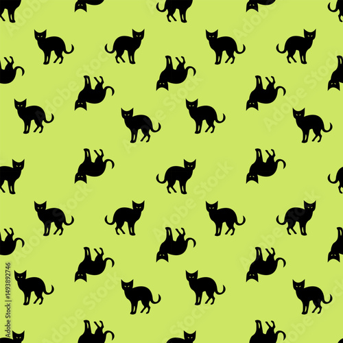 Repeating black cat silhouettes on bright green background, ideal for Halloween or themed textiles and wallpapers. Vector art