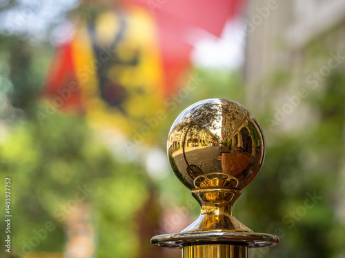 Reflective Brass Ball in Outdoor Setting, city of Bern