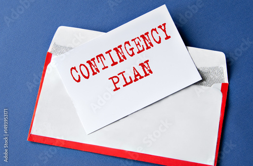 CONTINGENCY PLAN - words on a white sheet lying on an envelope on a blue background