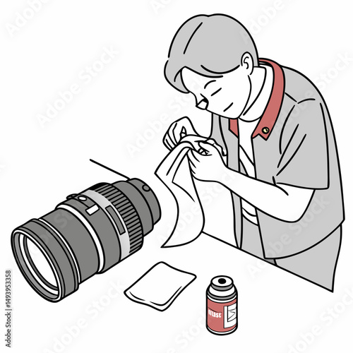 Technician carefully cleaning camera lens equipment
