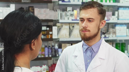 Pharmacist attentively listens to a client's health concerns