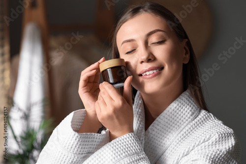 Beautiful woman with jar of...