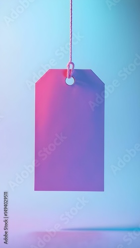 Vibrant hanging tag in gradient colors against a softly lit background, showcasing minimalist design in an artistic arrangement