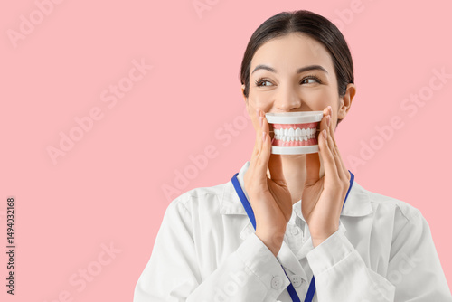 Young female dentist with j...