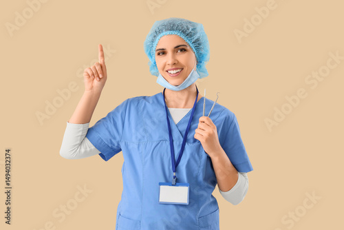 Female dentist with tools p...