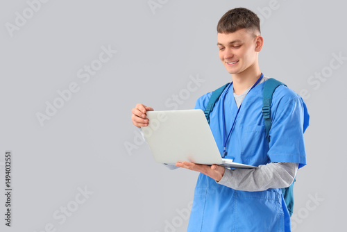 Male medical intern with la...