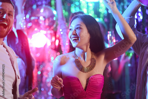 Young Asian woman dancing a...