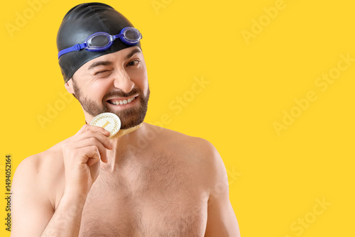 Male swimmer with first pla...