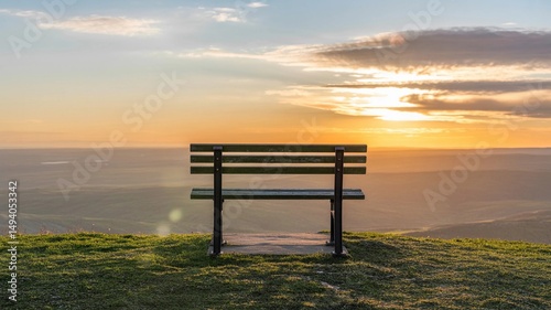 Empty Wooden Bench Facing Sunset on Hilltop