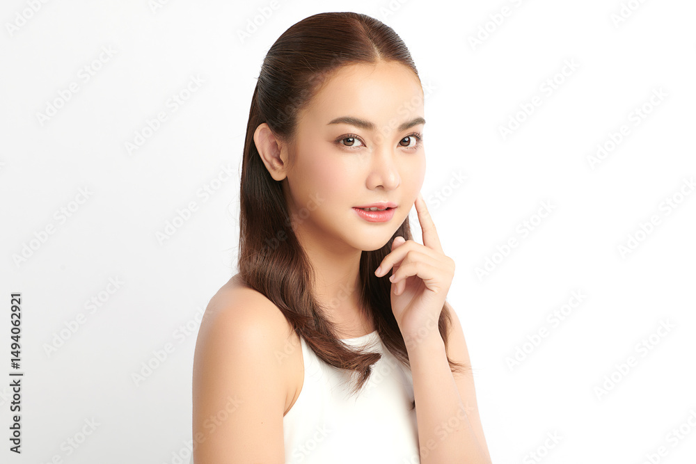 A beautiful young Asian woman with clean, fresh skin against a white background. Skincare, facial treatment, cosmetology, beauty, and spa. An elegant portrait of an Asian woman. A beautiful young Asian woman with clean, fresh skin against a white background. Skincare, facial treatment, cosmetology, beauty, and spa. An elegant portrait of an Asian woman.