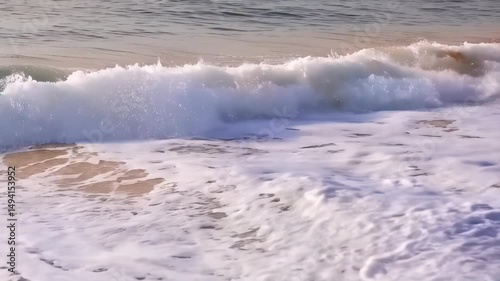 Ocean waves crashing on the sandy beach, a serene seascape with dynamic water movement and coastal scenery, foamy water covering the beach