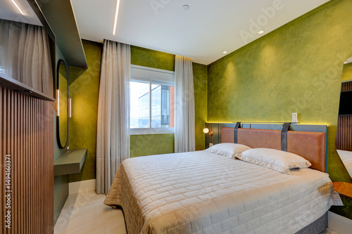 Modern bedroom and bathroom interiors with contemporary design, elegant decor, and natural light in a stylish apartment in Brazil

